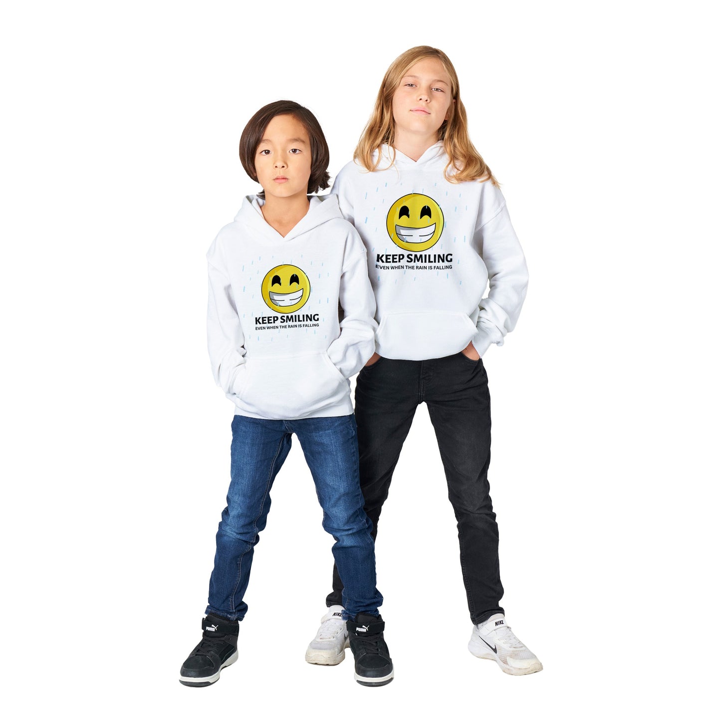 Inspirational kids Unisex Hoodie with a positive affirmation: "I Keep Smiling, even when the rain is falling". An image of an emoji smiling and drop of rain - white