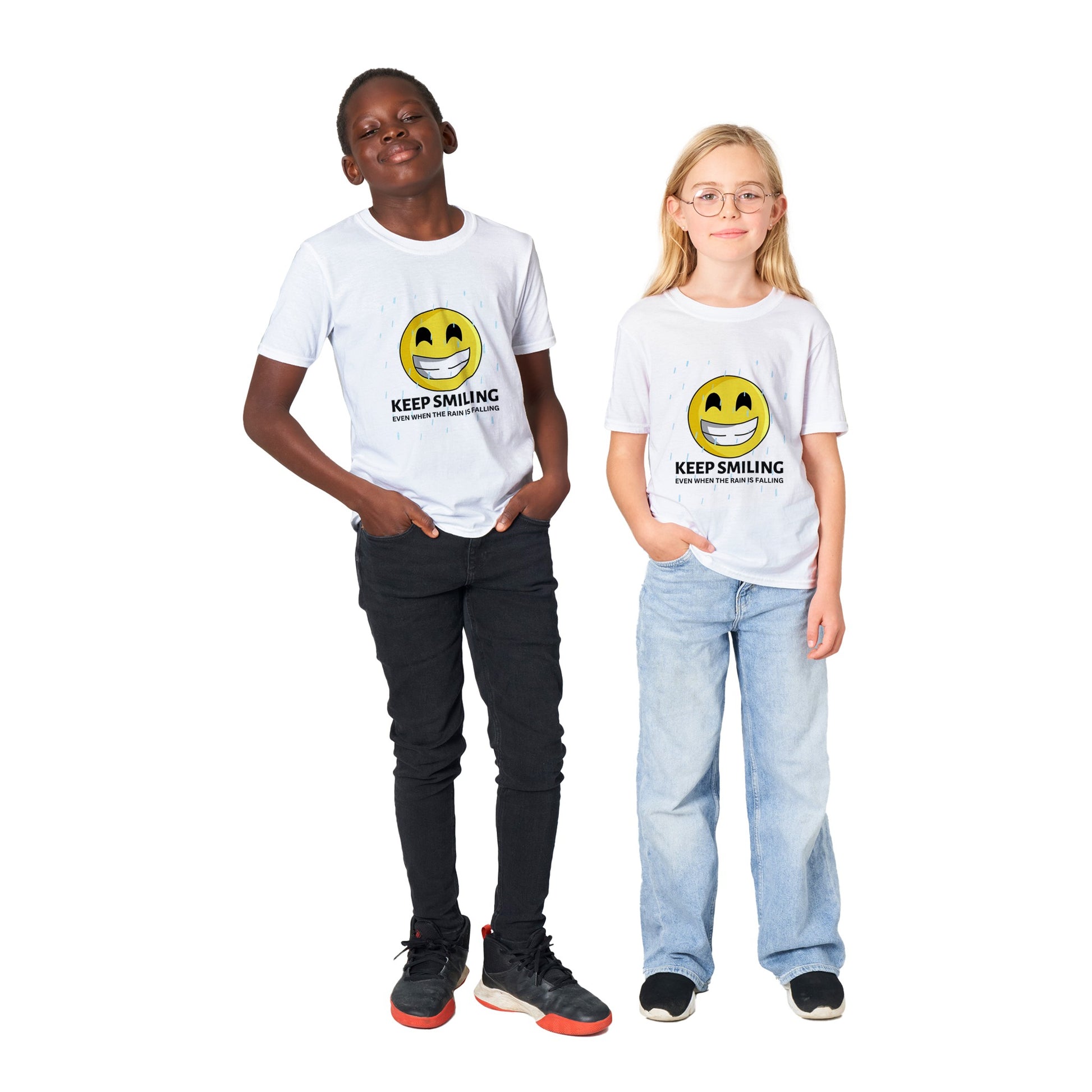 Inspirational Kids T-Shirt with a positive affirmation: "I Keep Smiling, even when the rain is falling". An image of an emoji smiling and drop of rain - white tee