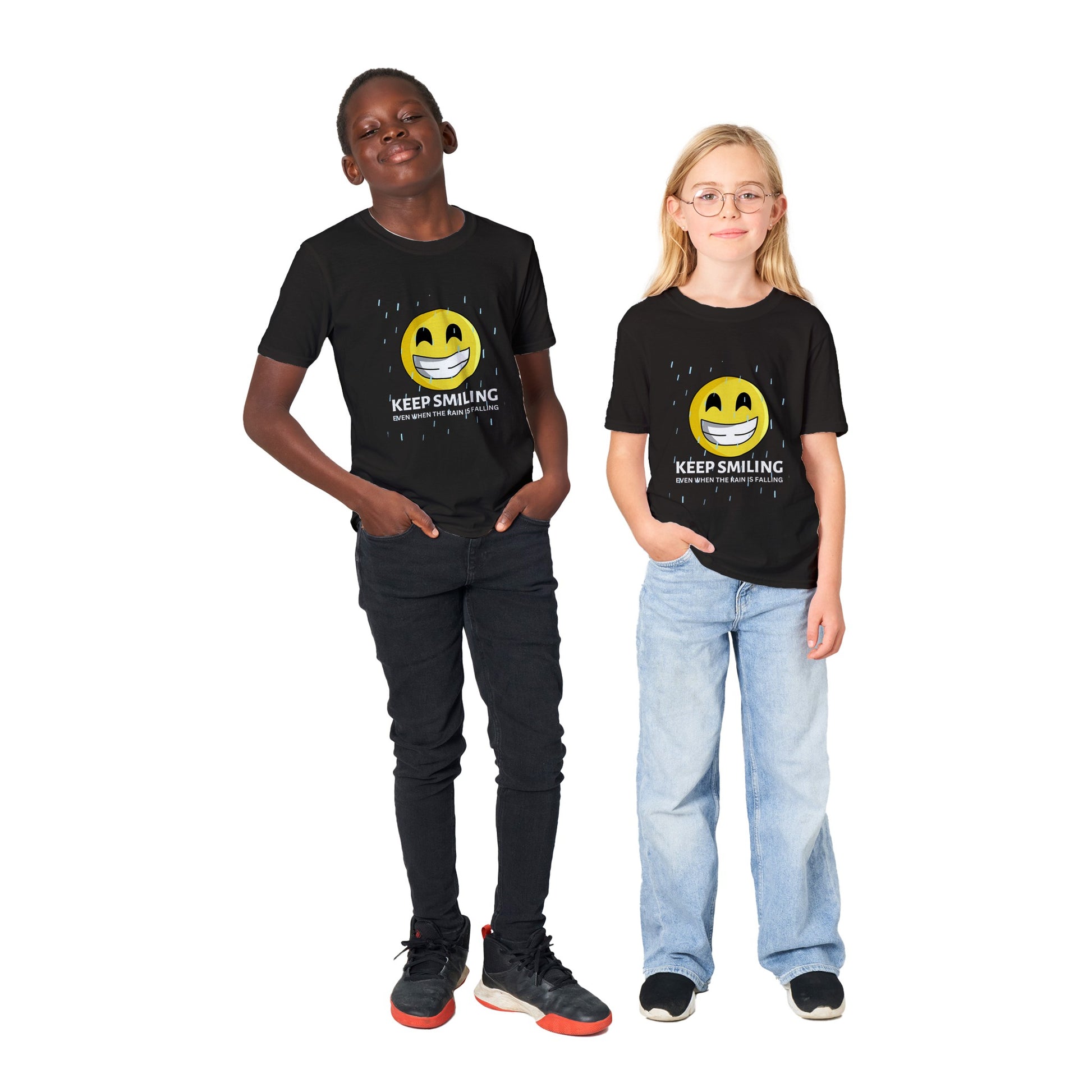 Inspirational Kids T-Shirt with a positive affirmation: "I Keep Smiling, even when the rain is falling". An image of an emoji smiling and drop of rain - black