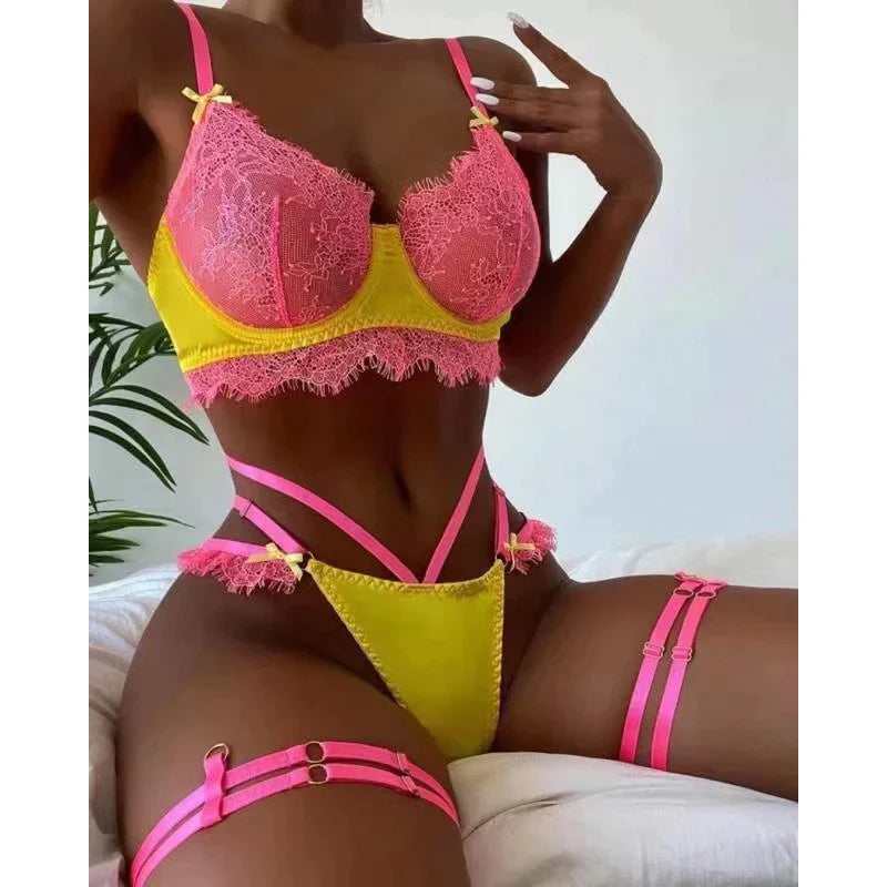 Lingerie Set, where you take control and set the rules. This exotic three-piece ensemble is designed to captivate and empower, with vibrant shades of bright pink and yellow that command attention and exude confidence.